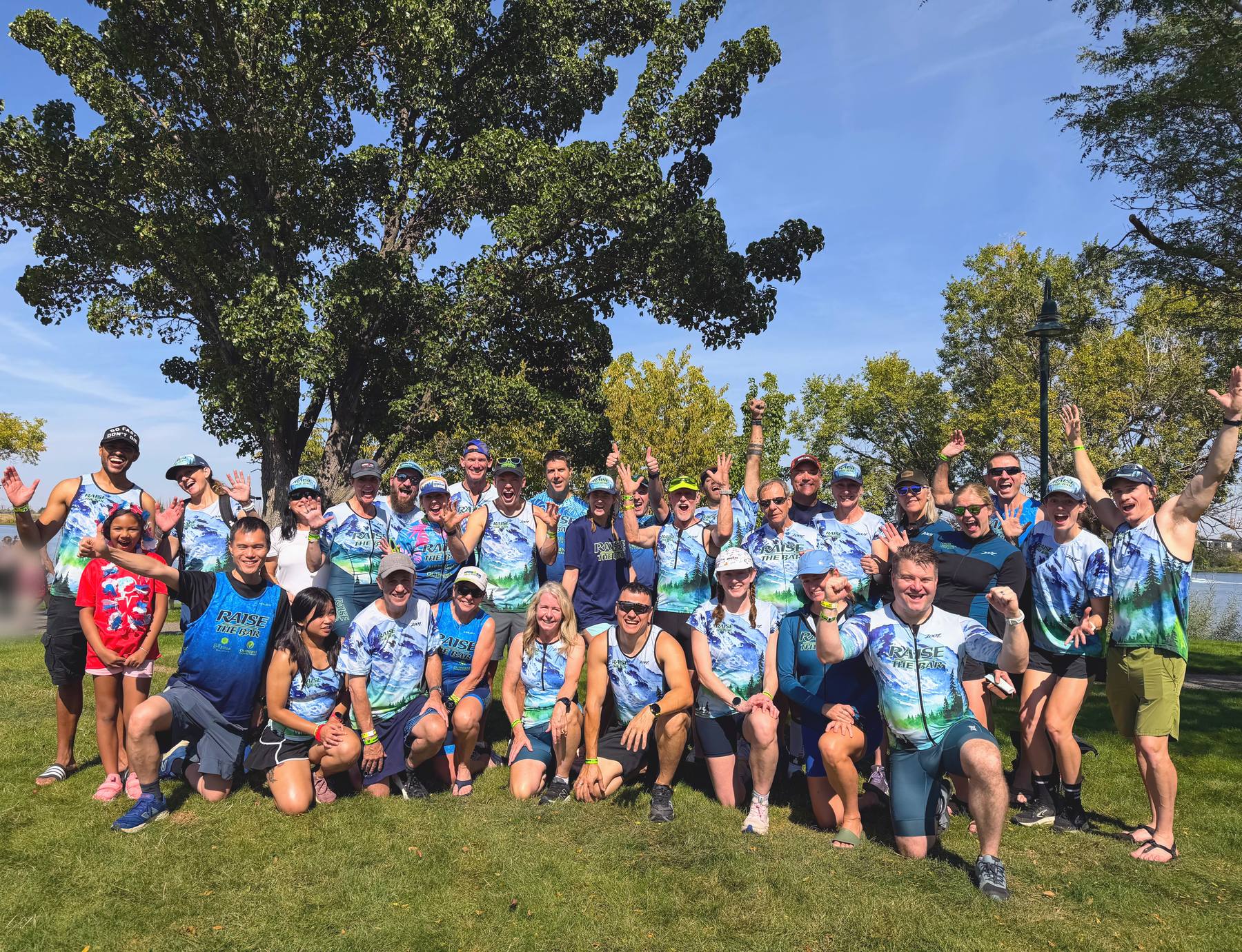 Raise the Bar athletes in team kit celebrating together